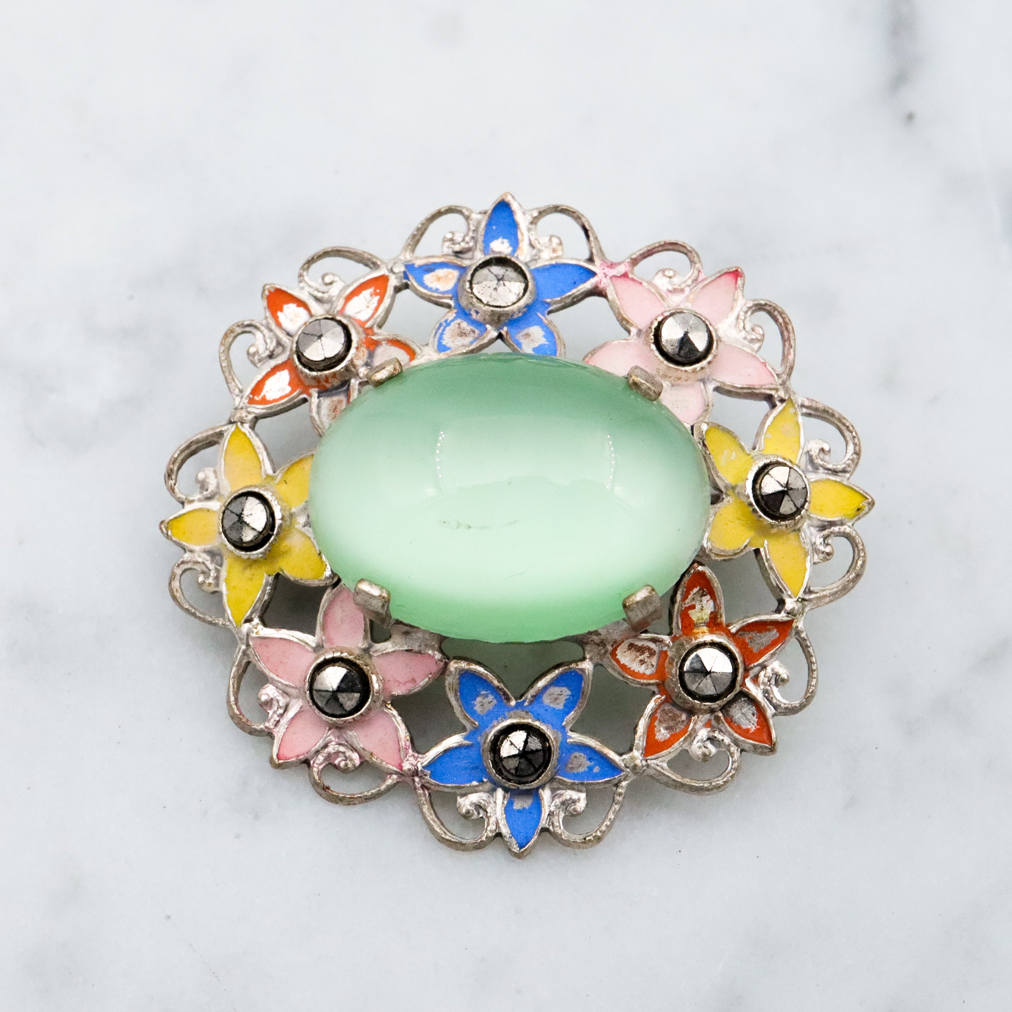 Antique Art Deco green cats eye enamel flower brooch